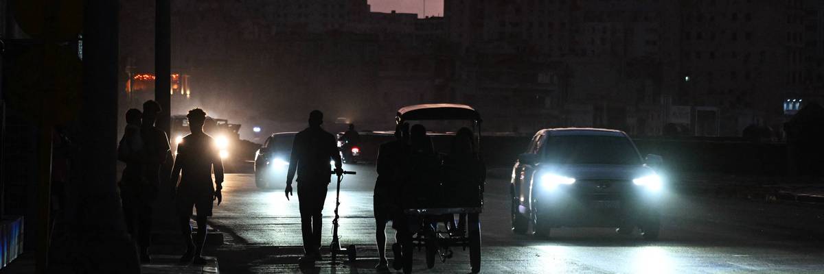 People on a street in Cuba during a blackout.