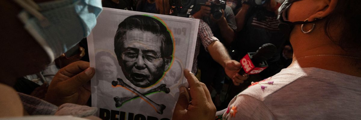 People opposed to the release from prison of former Peruvian President Alberto Fujimori participate in a protest in Lima on March 17, 2022.