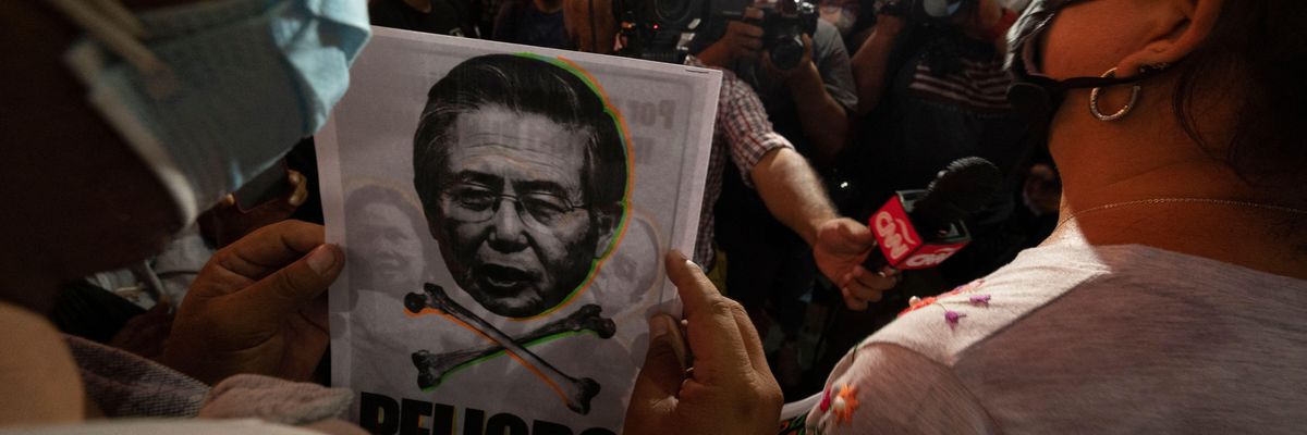 People opposed to the release from prison of former Peruvian President Alberto Fujimori participate in a protest in Lima on March 17, 2022.