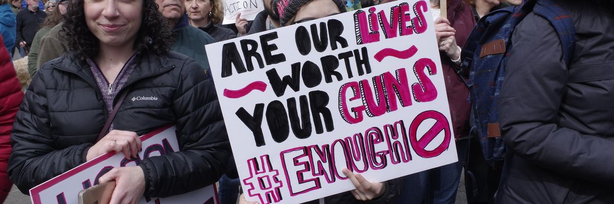 People participate in a March 24, 2018 "March for Our Lives" protest