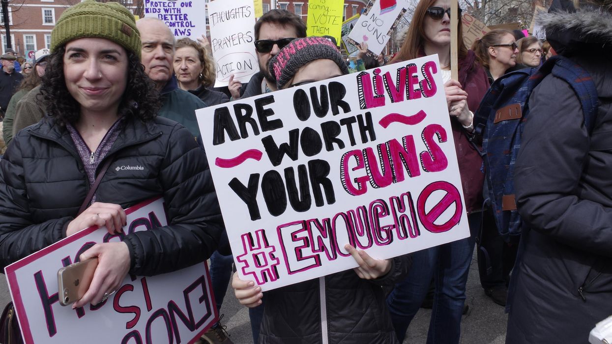 People participate in a March 24, 2018 "March for Our Lives" protest