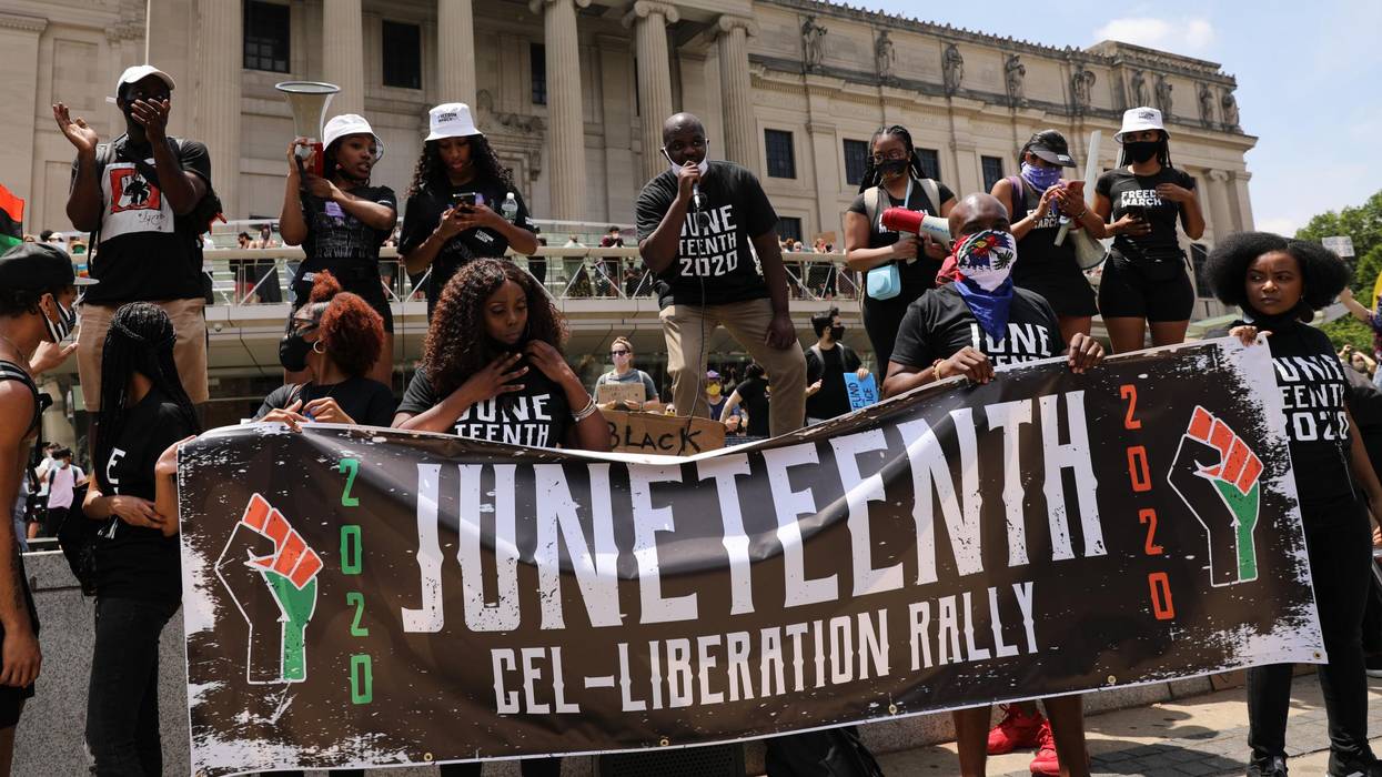 People participate in a march in Brooklyn for both Black Lives Matter and to commemorate the 155th anniversary of Juneteenth on June 19, 2020 in New York City