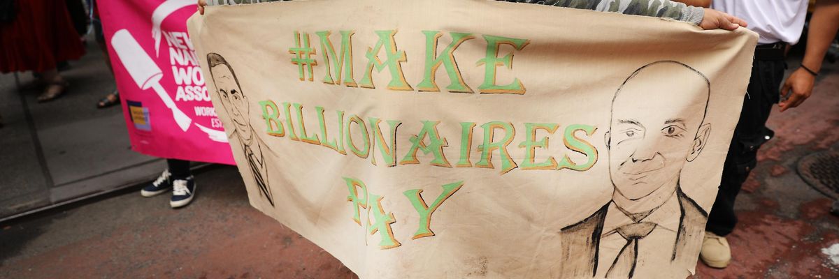 People participate in a "March on Billionaires" event on July 17, 2020 in New York City.