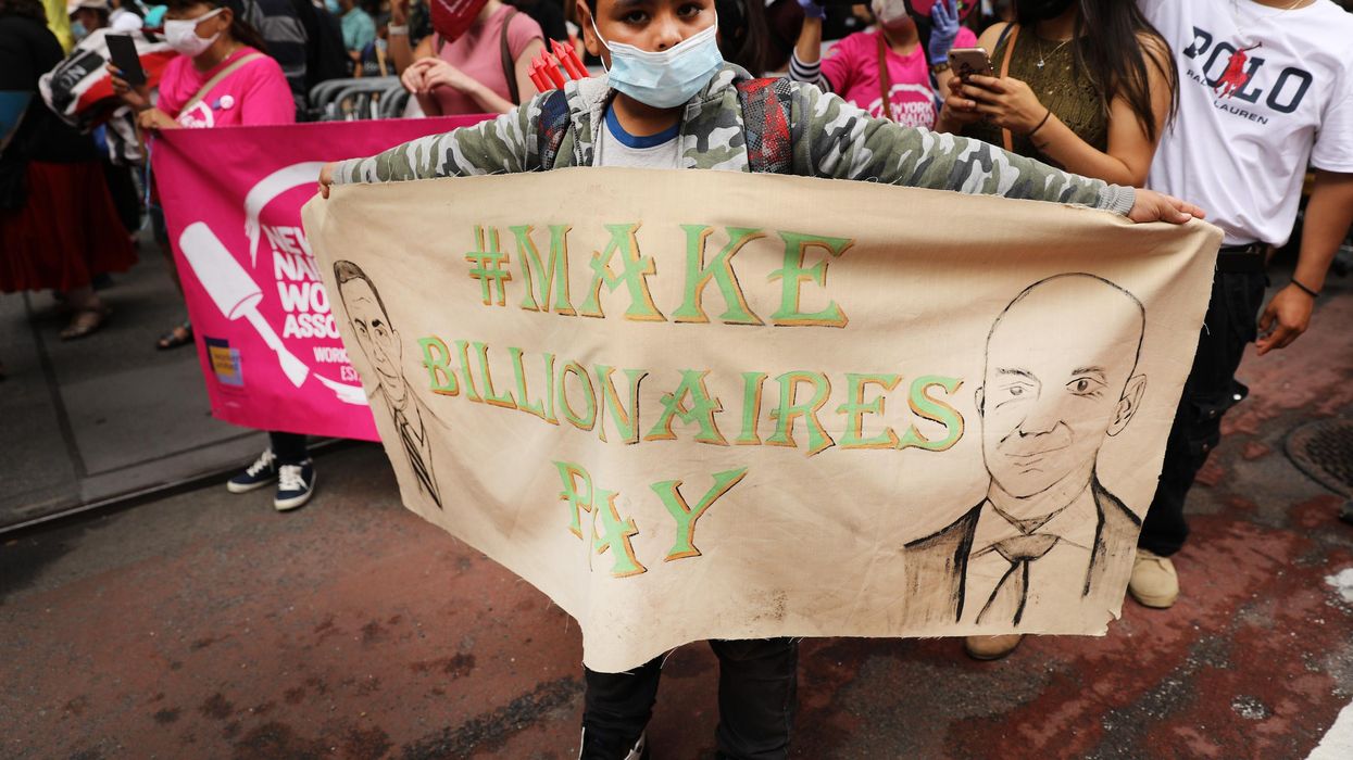 People participate in a "March on Billionaires" event on July 17, 2020 in New York City.