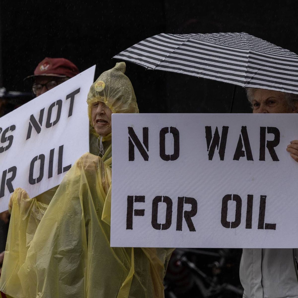 People participate in a "No War on Venezuela" protest