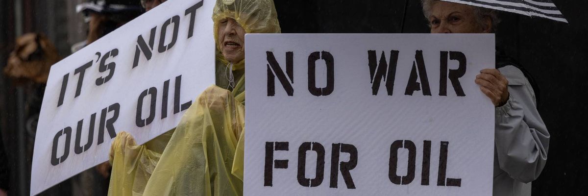 People participate in a "No War on Venezuela" protest