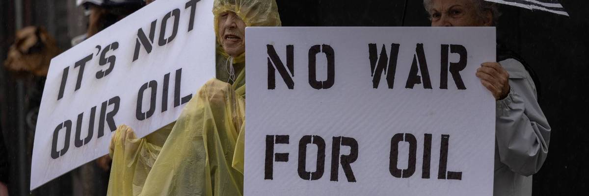 People participate in a “No War on Venezuela” protest