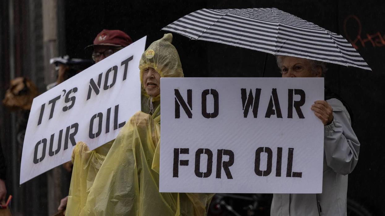 People participate in a “No War on Venezuela” protest