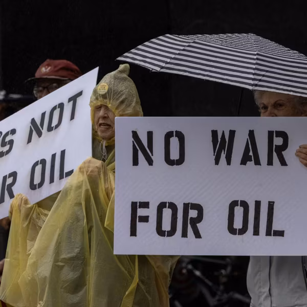 People participate in a "No War on Venezuela" protest