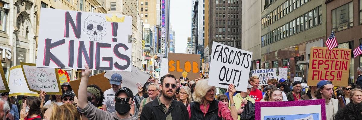 People participate in No Kings march in Times Square.