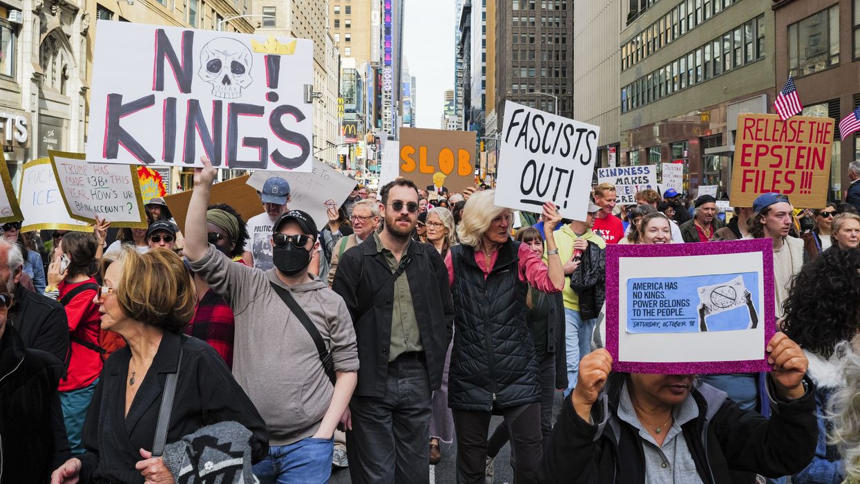 People participate in No Kings march in Times Square.