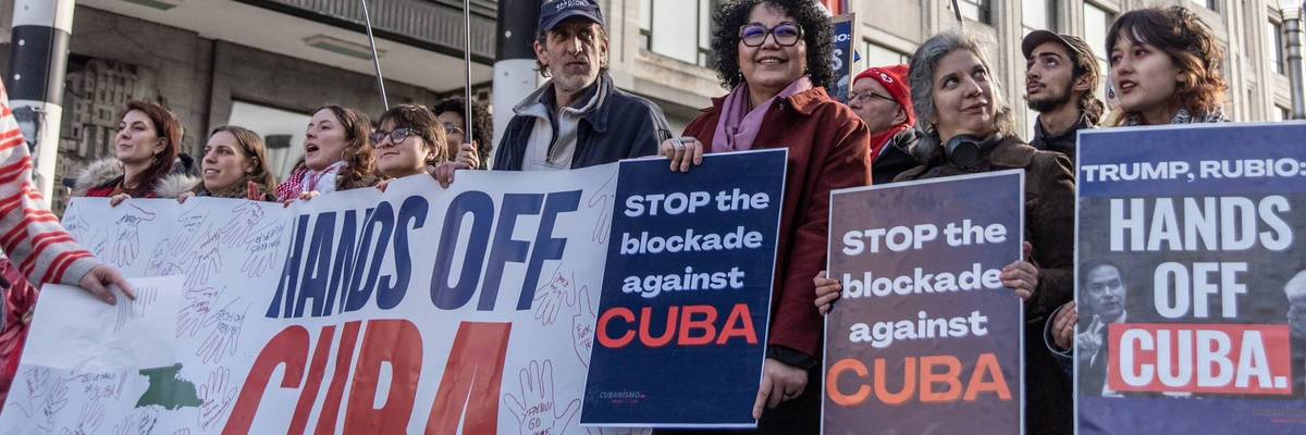 People protest against Trump aggression against Cuba with signs reading "Stop the Blockade Against Cuba"