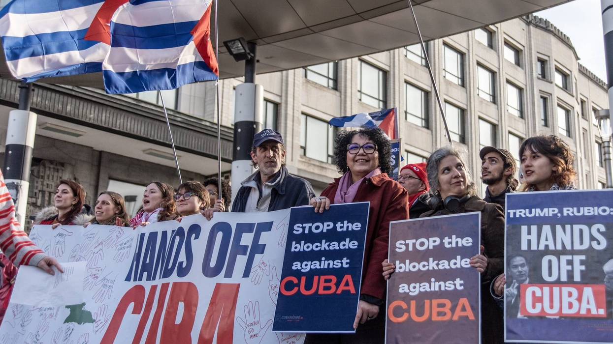 People protest against Trump aggression against Cuba with signs reading "Stop the Blockade Against Cuba"