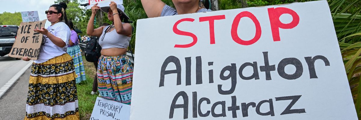 People protest Alligator Alcatraz.
