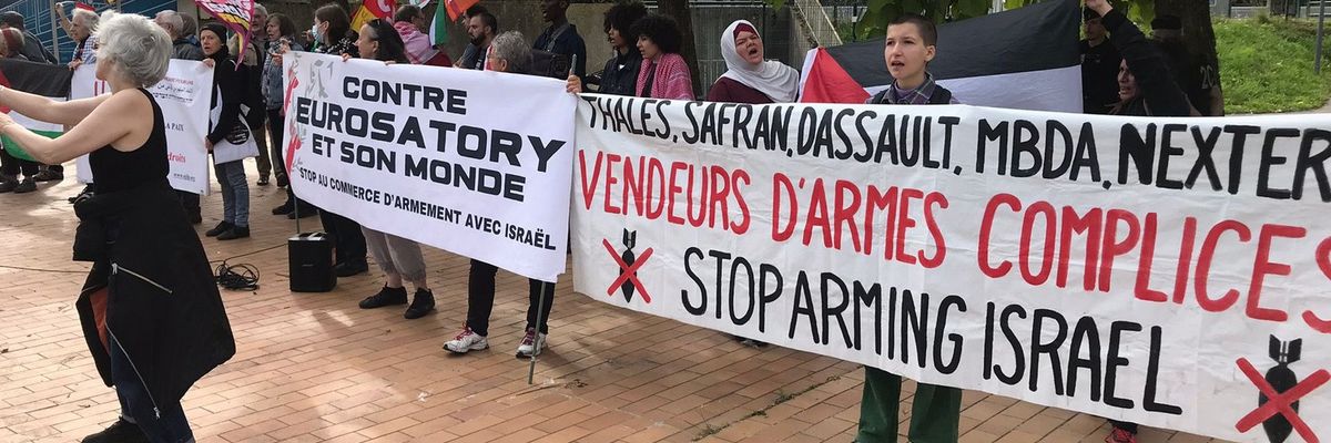 People protest arms sales to Israel outside the Eurosatory expo in Paris