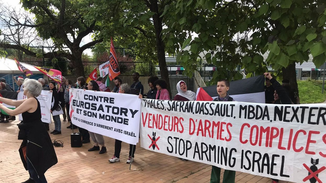 People protest arms sales to Israel outside the Eurosatory expo in Paris