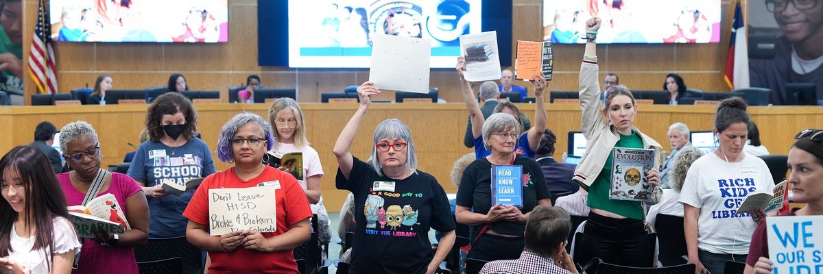 People protest at a Houston school board meeting