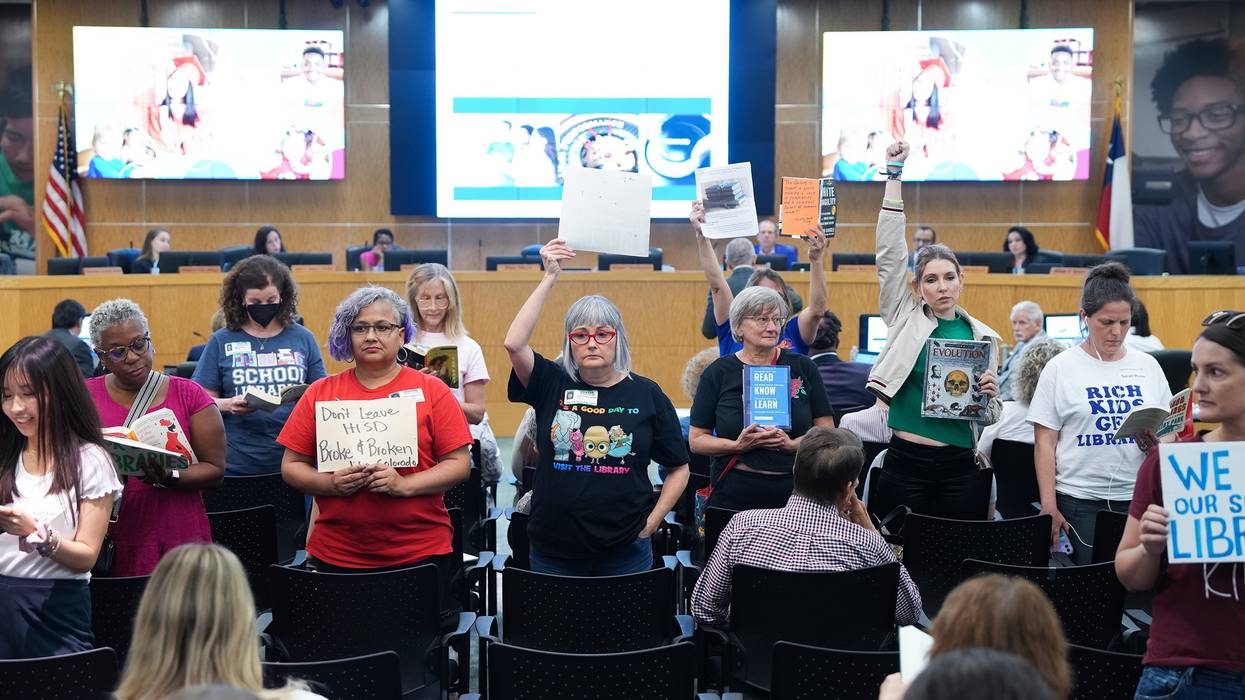People protest at a Houston school board meeting