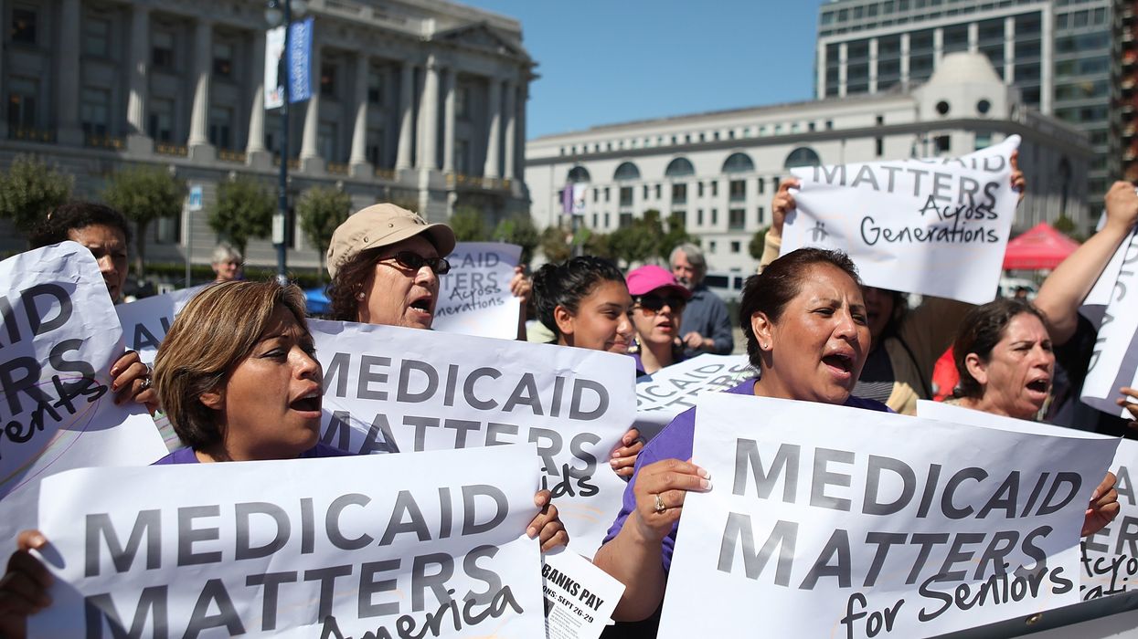 People protest cuts to Medicaid.