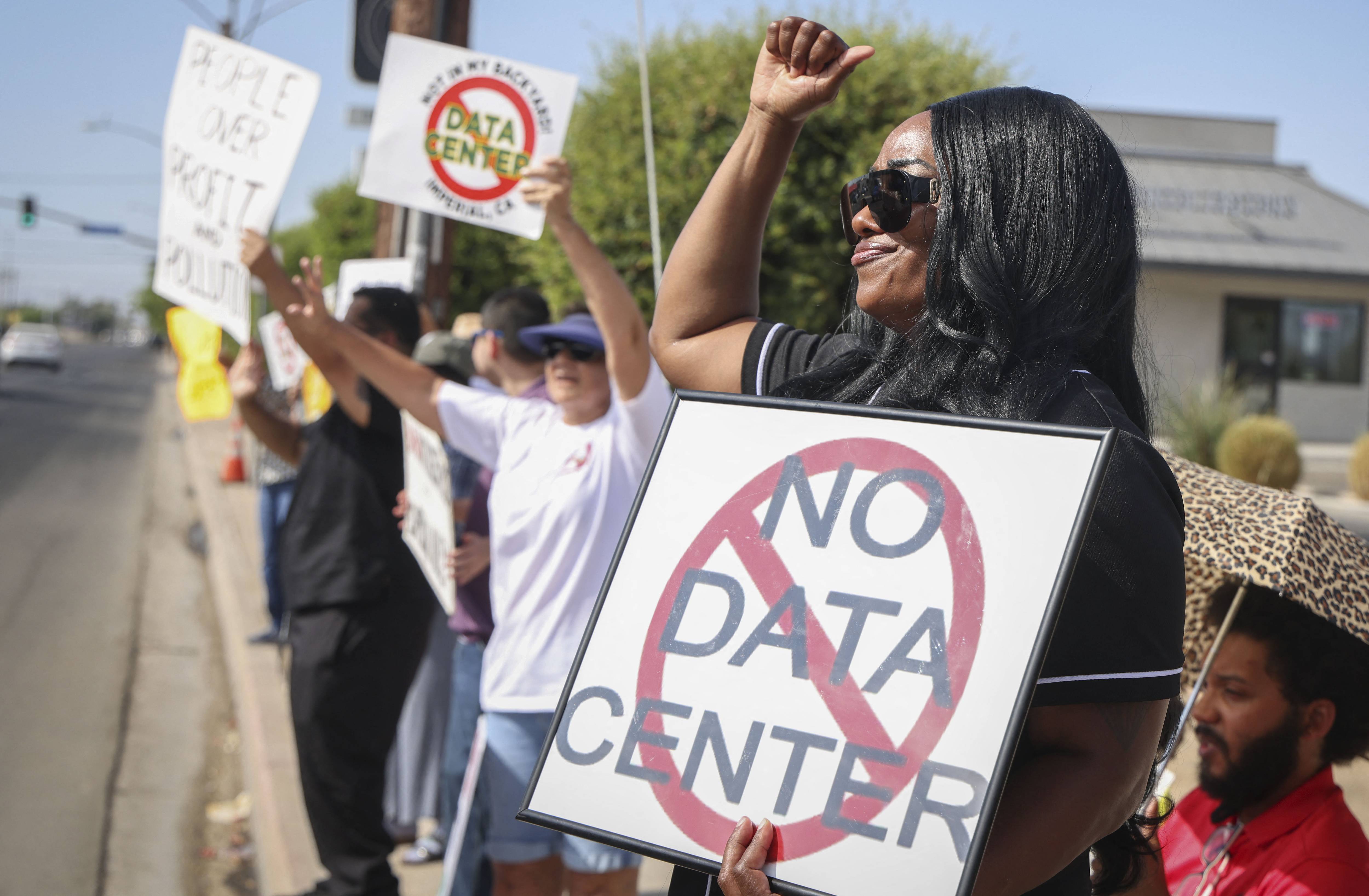 People protest data centers.