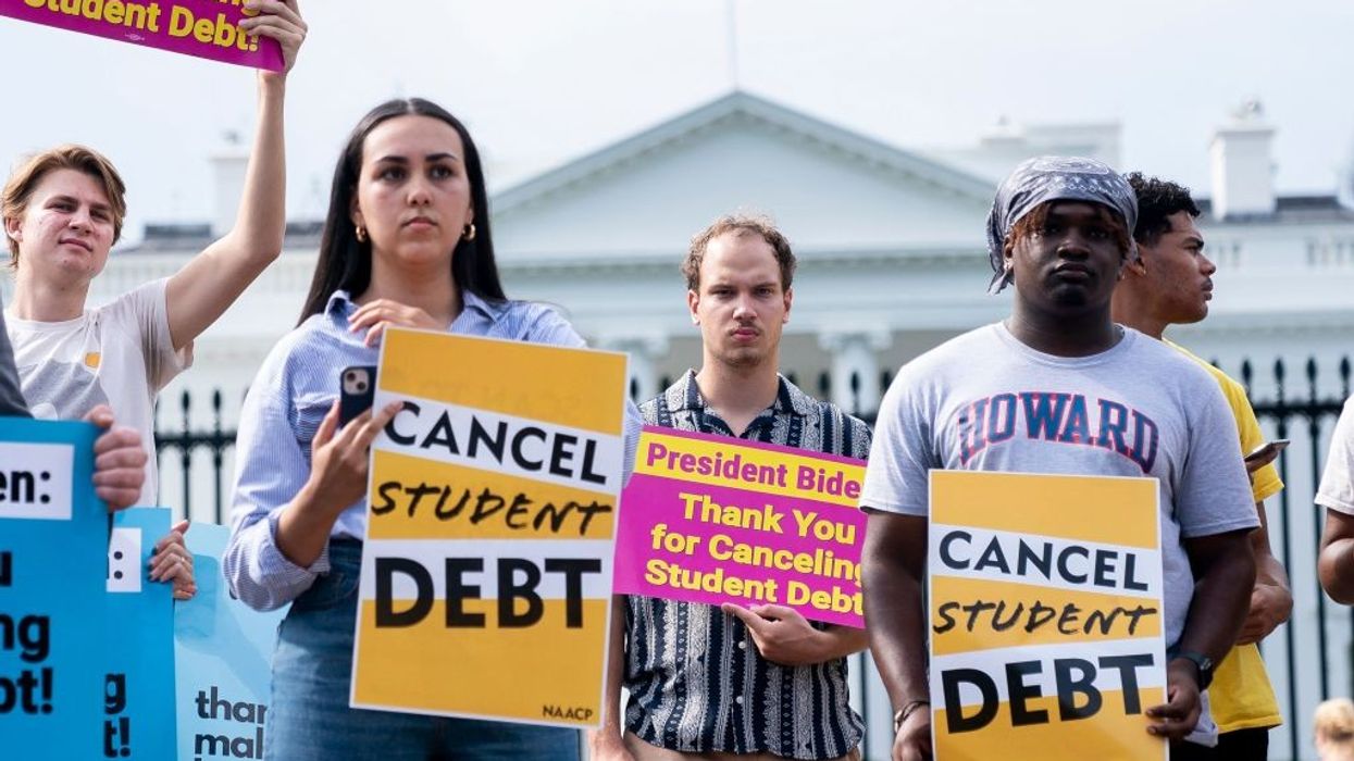 People protest for student debt cancellation outside the White House