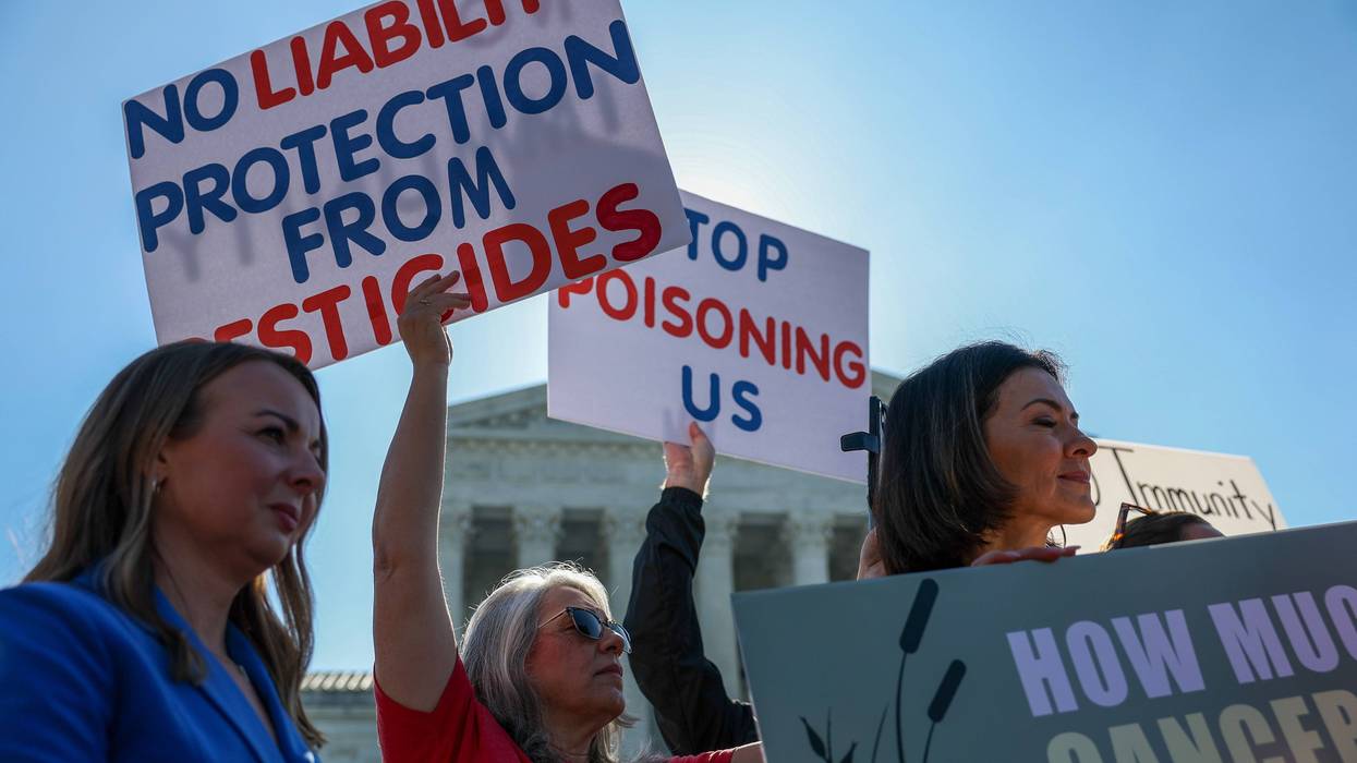 People protest liability protection for pesticide companies.