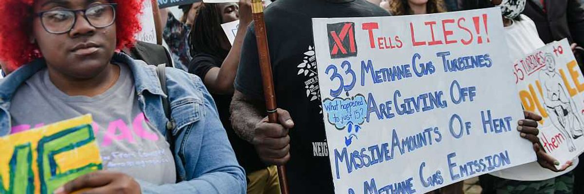 People protest Musk's xAI in Memphis.