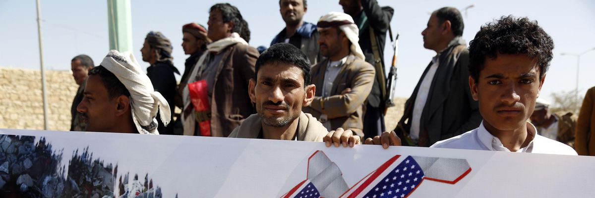 People protest the aerial attacks carried out by jet crafts of the coalition led by Saudi Arabia targeting a prison in the Houthi strong-hold Saadah Province, on January 22, 2022 in Sa'ada, Yemen.