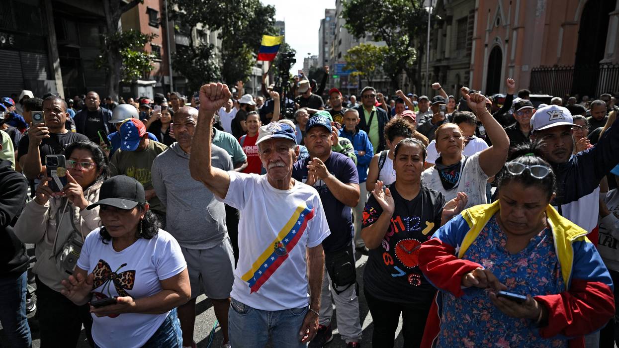 People protest the kidnapping of Maduro in Caracas.