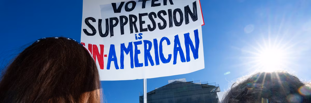 People protest the Supreme Court as it reviews Voting Rights case.
