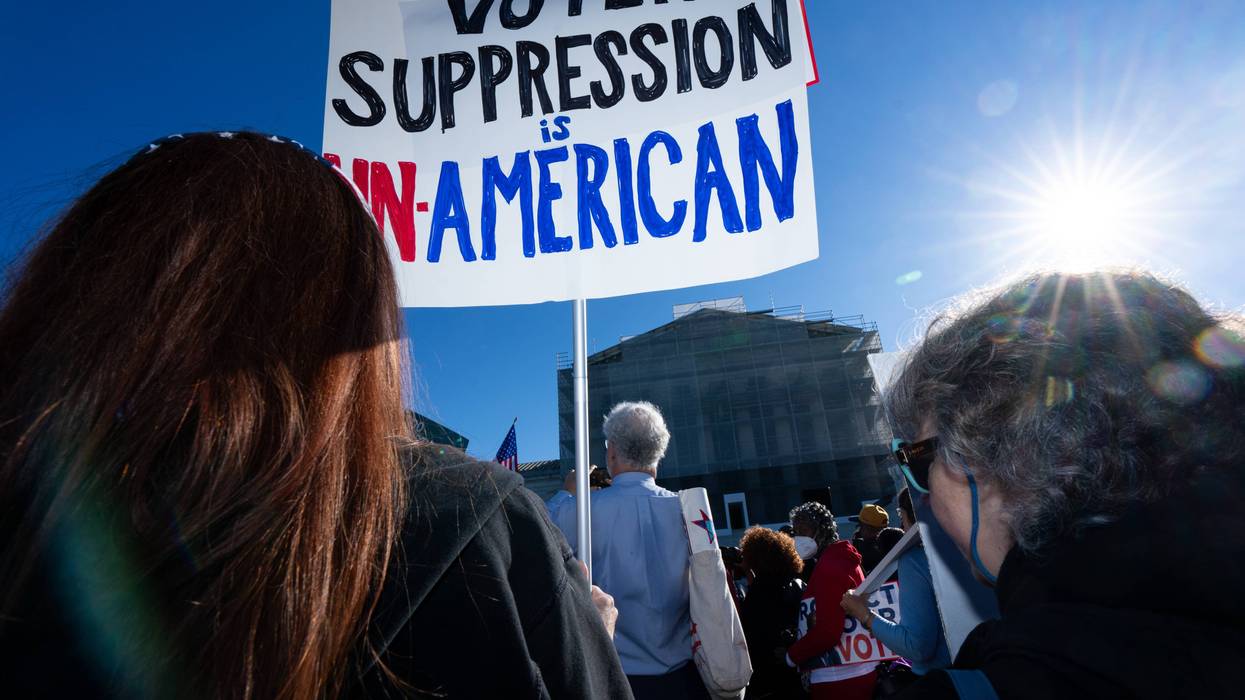 People protest the Supreme Court as it reviews Voting Rights case.