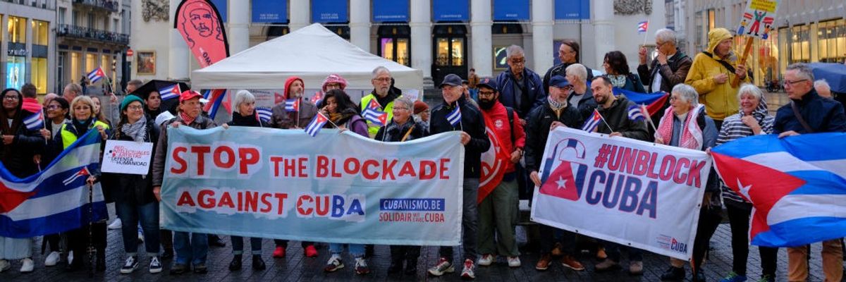People protest the U.S. embargo of Cuba in Brussels