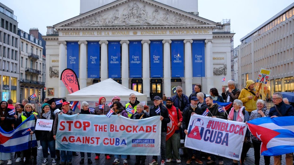 People protest the U.S. embargo of Cuba in Brussels