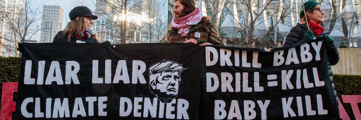 People protest Trump's climate policies in London .