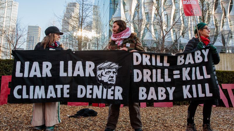 People protest Trump's climate policies in London .