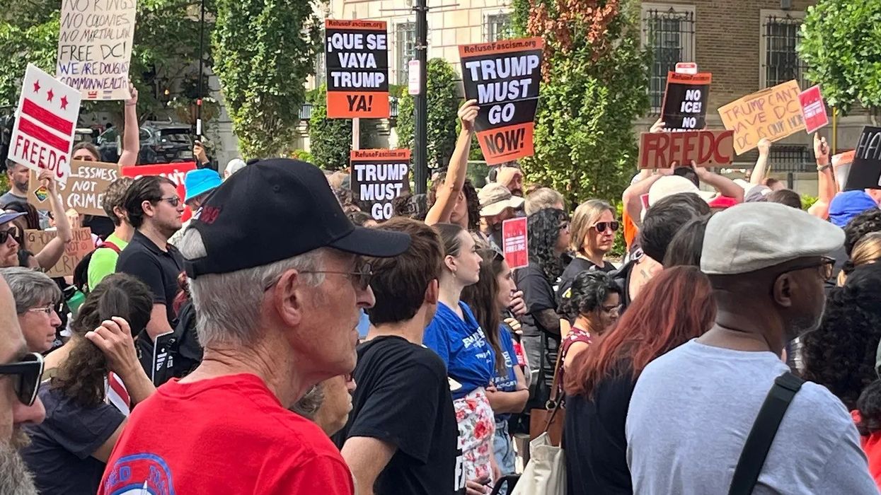 People protest Trump's DC takeover.