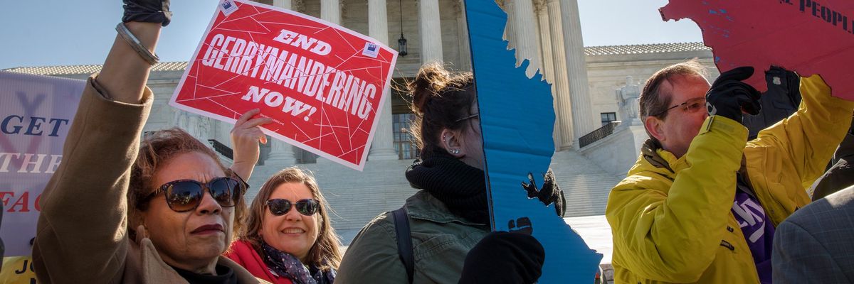 People rally against gerrymandering in front of the U.S. Supreme Court on March 26, 2019.