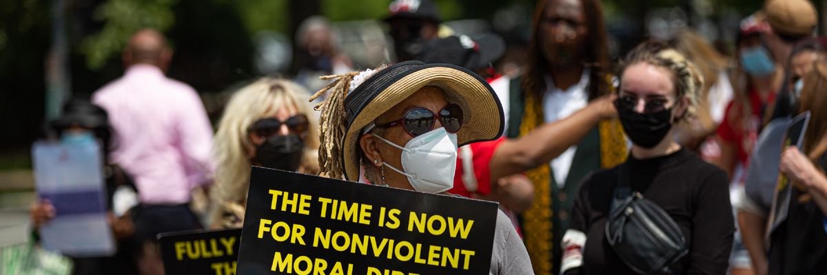 People rally demanding passage of the For the People Act