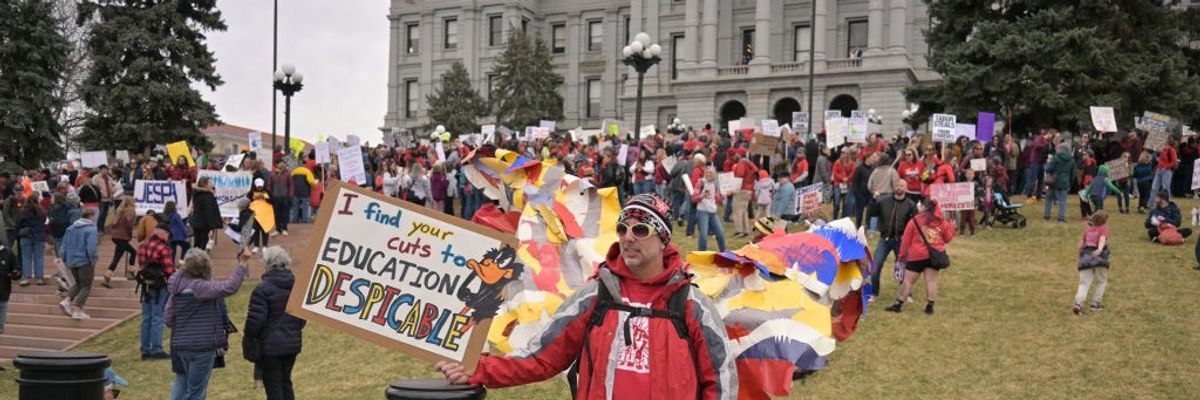 People rally for the fully funded public schools outside the Colorado State Capitol