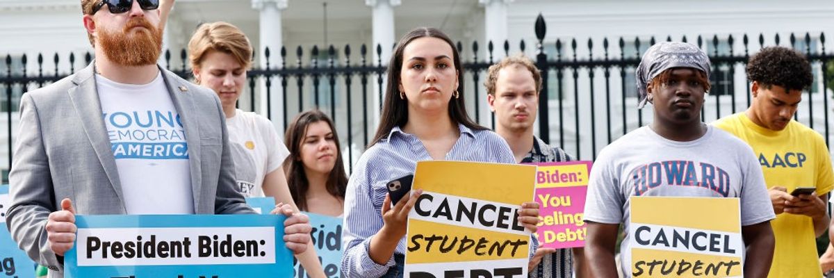 People rally in support of President Joe Biden's student debt cancellation plan on August 25, 2022 in Washington, D.C.