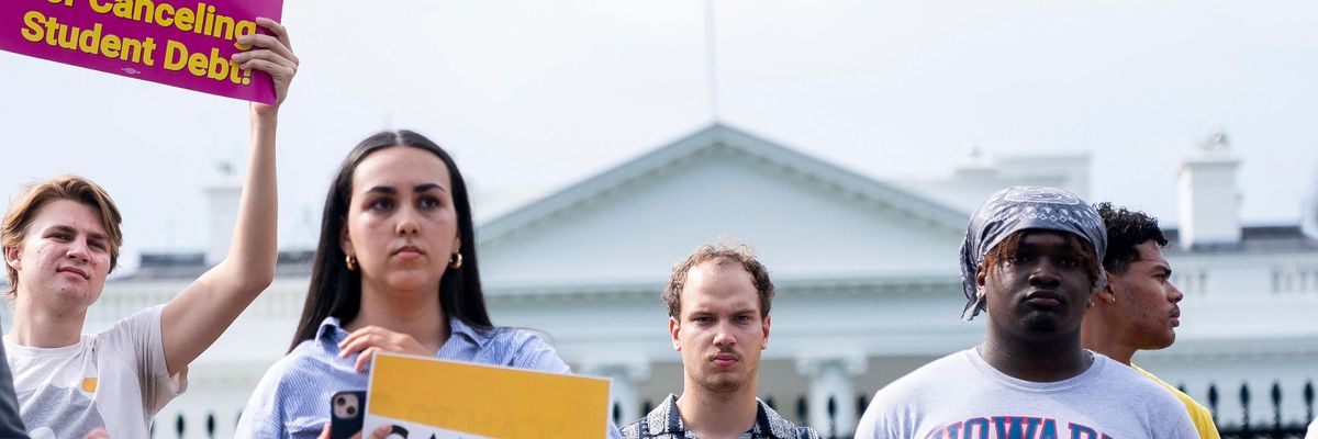People rally in support of student debt cancellation outside of the White House
