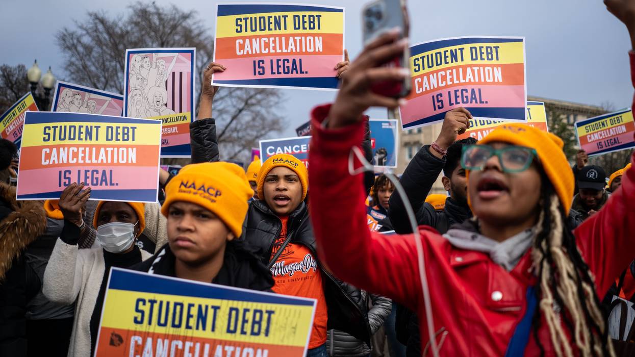 People rally in support of the Biden administration's student debt relief plan in front of the Supreme Court