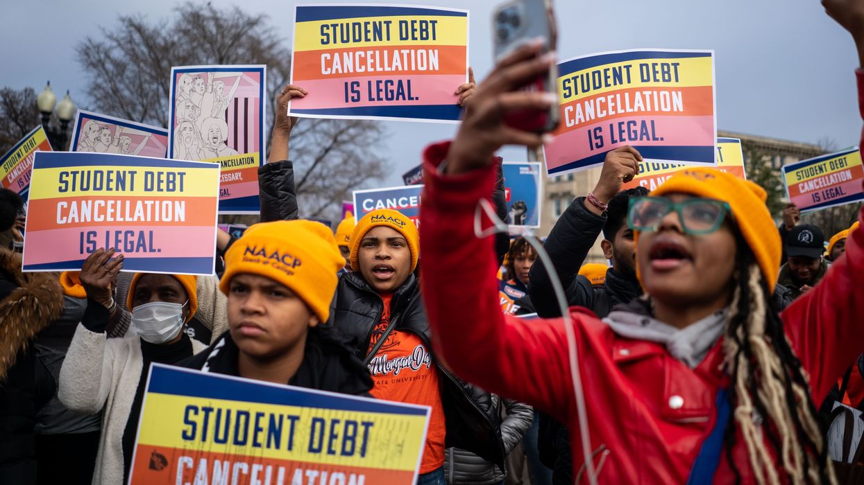 People rally in support of the Biden administration's student debt relief plan in front of the Supreme Court