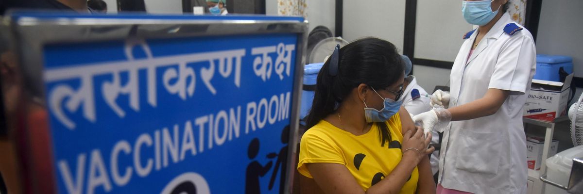 People receive coronavirus vaccines in Mumbai, India