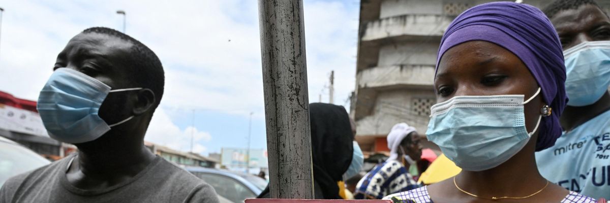 People receive the Pfizer vaccine in West Africa