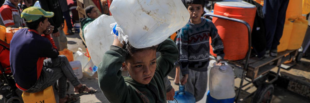 People receive water in Rafah, Gaza