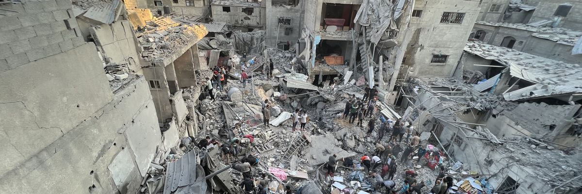 People search through the rubble of an  Israeli airstrike on the Jabalia refugee camp 