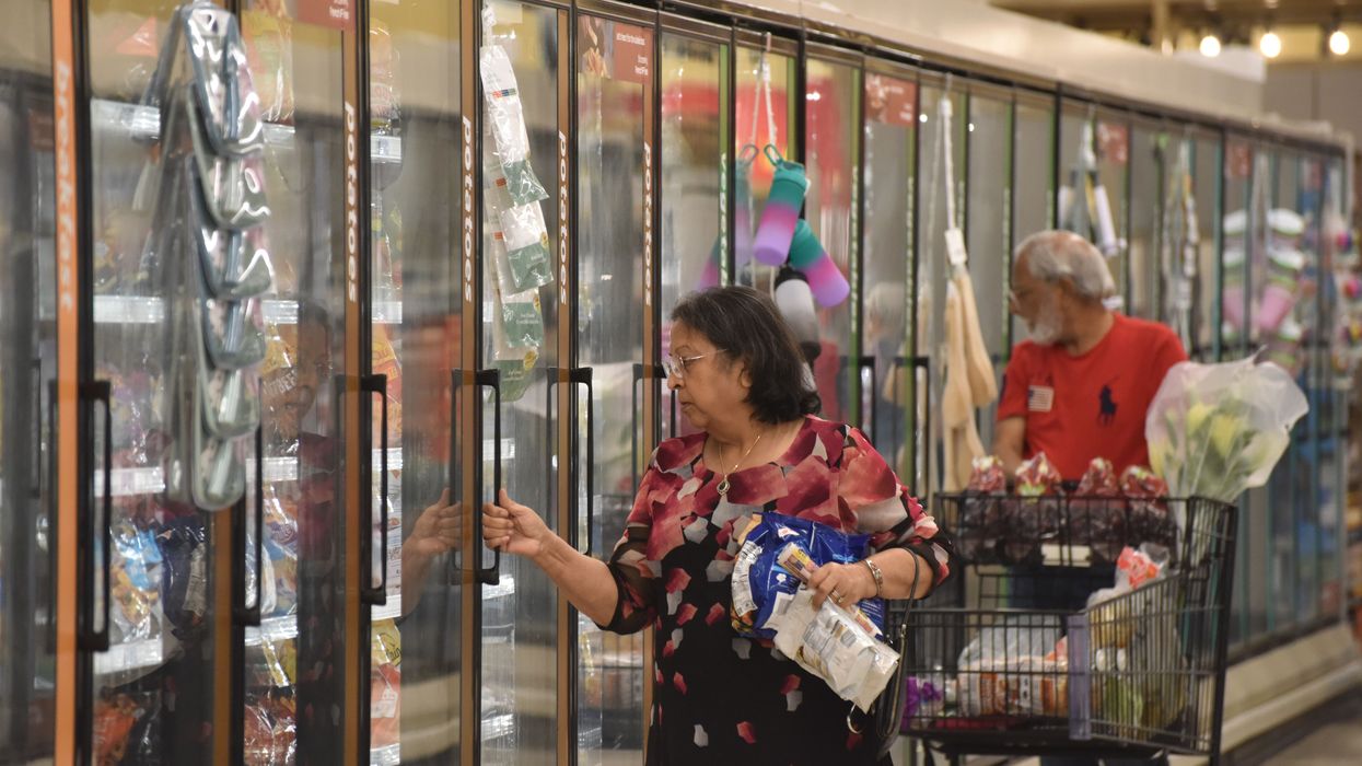 People shop at a supermarket
