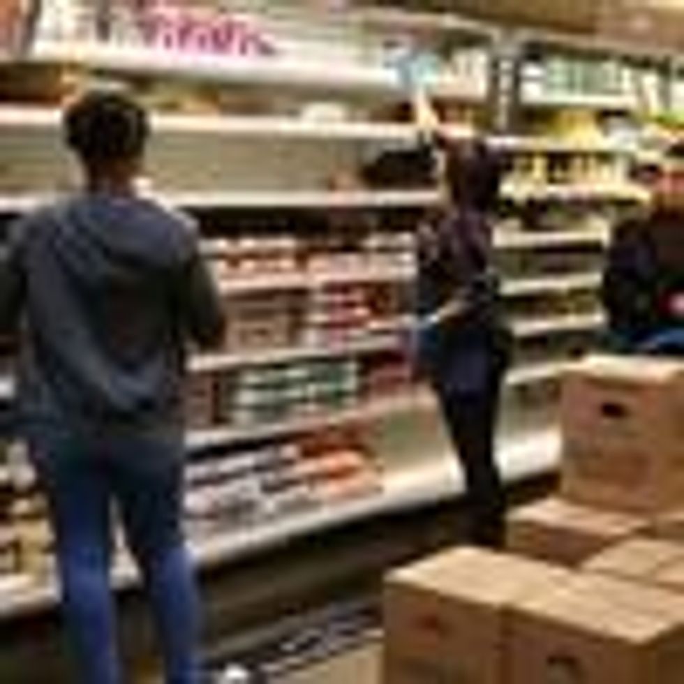 People shopping in the egg and dairy case on March 13, 2020 at Whole Foods Merket in Vauxhall, New Jersey. (Photo: Rich Graessle/Icon Sportswire via Getty Images)