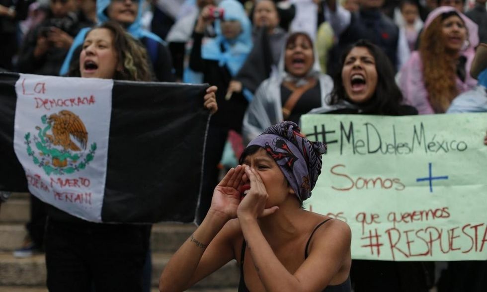 People shout demanding the return of the 43 missing students during a massive march in Mexico City. (Photo: Dario Lopez-Mills/AP)